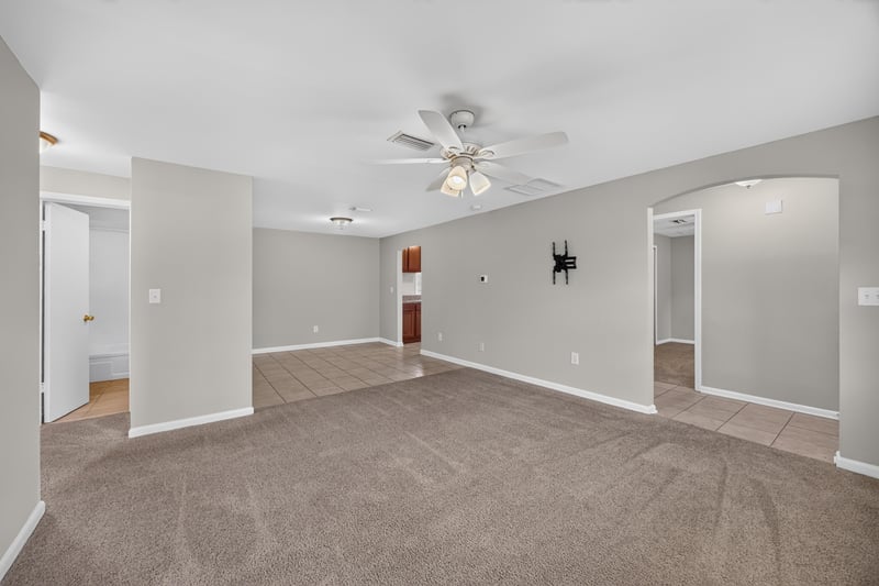 Open living and dining area with carpet flooring at 1143 Tumbleweed Dr, Orange Park, FL 32065