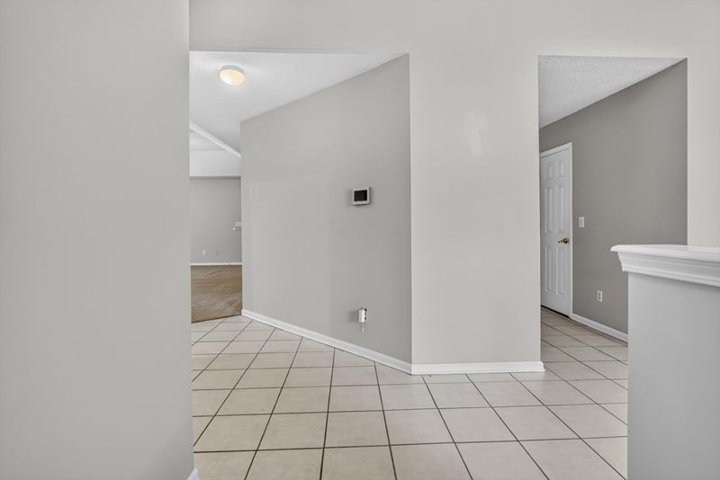 Hallway with tile flooring at 11669 Collins Creek Dr, Jacksonville, FL 32258
