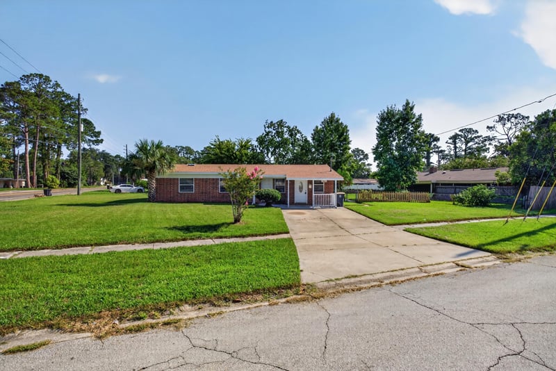 Front exterior with driveway and lawn at 5503 Boeing Dr, Jacksonville, FL 32207