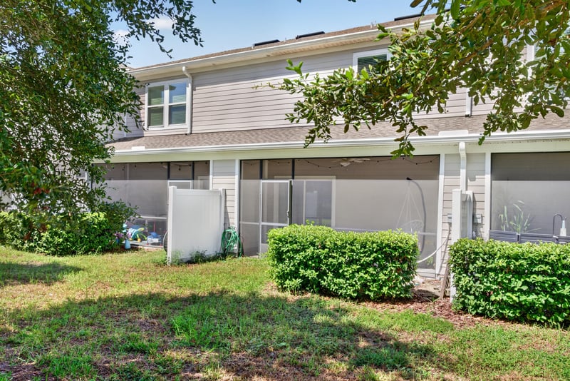 Backyard with trees near the porch at 1186 Beach Dune Dr, Jacksonville, FL 32233
