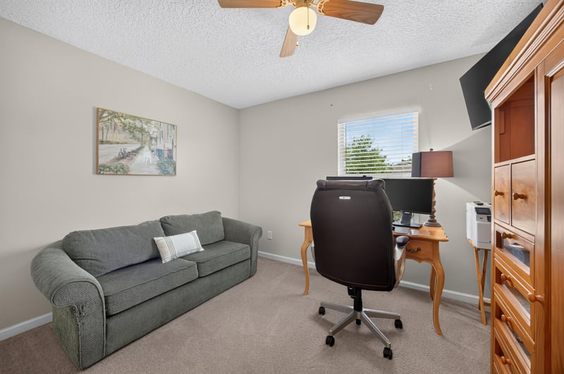 Bedroom used as an office with desk and shelving at 3660 Middlebrook Dr, Orange Park, FL 32065