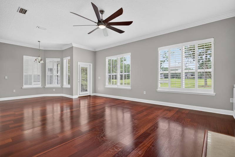 Family room with bay window and ceiling fan at 4109 Eagle Landing Pkwy, Orange Park, FL 32065