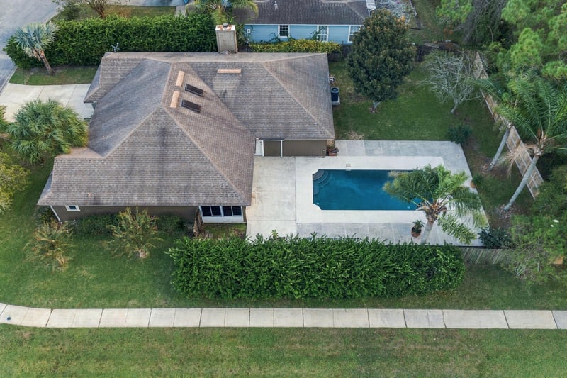 Aerial view of the backyard pool, photographed by Megapixeler on Winding Springs Ct, Jacksonville