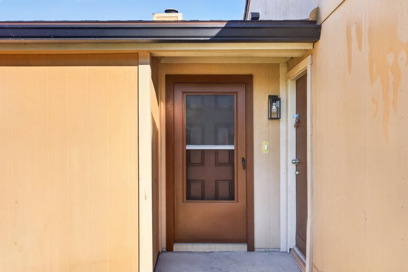 Close-up of wood front door at 8177 Virgo St, Jacksonville, FL 32216