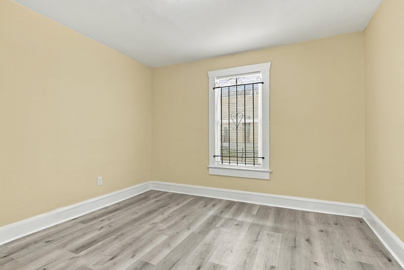 Empty bedroom with window light, photographed by Megapixeler on W 24th St, Jacksonville