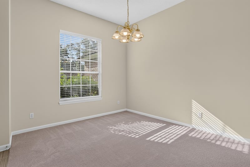 Dining area with chandelier and window at 299 John's Creek Pkwy, St. Augustine, FL 32092