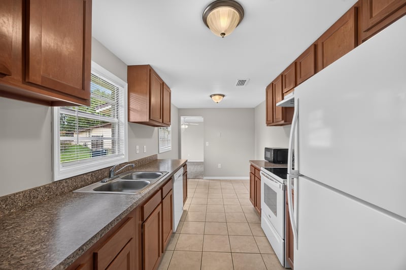 Kitchen with sink, window and tile floor at 1143 Tumbleweed Dr, Orange Park, FL 32065