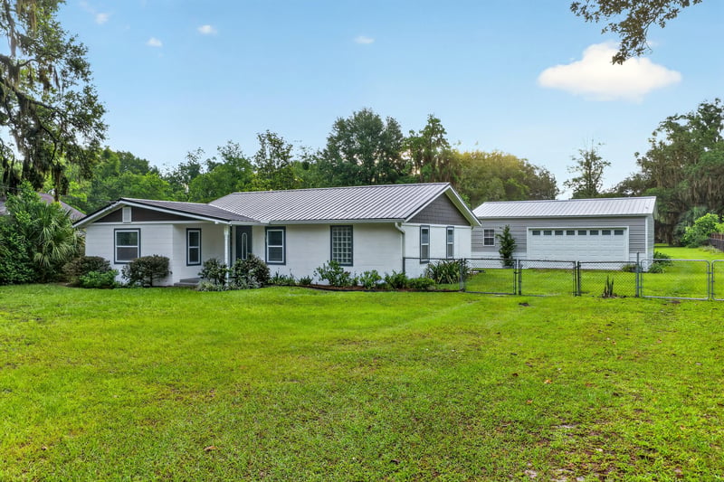 Front exterior with side carport and driveway at 1619 Hammond Blvd, Jacksonville, FL