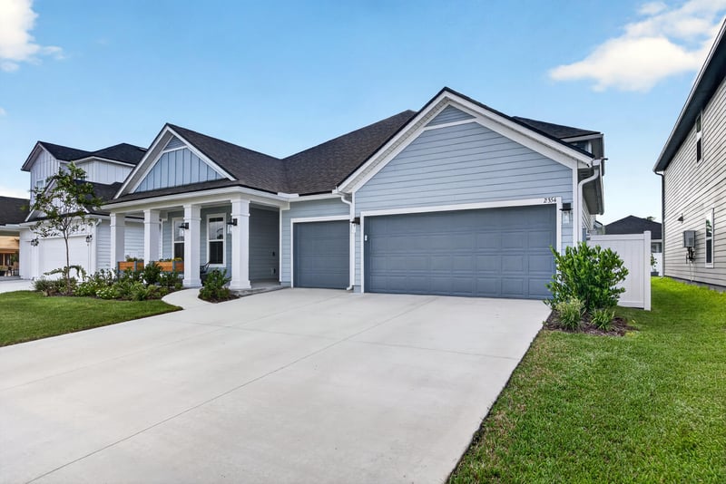 Front exterior with garage and driveway at 2354 Jennings Farm Dr, Middleburg, FL 32068