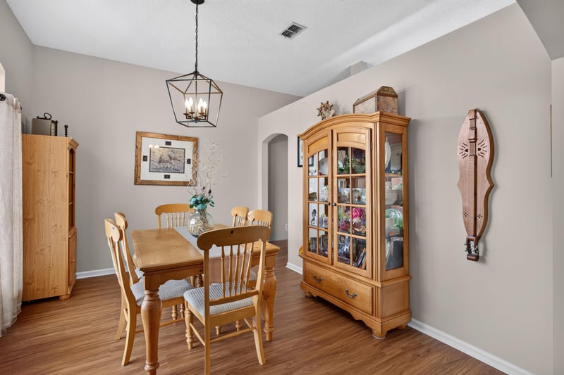 Dining room, china cabinet and wood floors at 13514 Las Brisas Way N, Jacksonville, FL