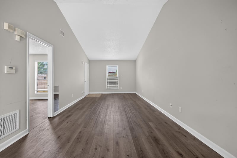 Bedroom view toward window and closet at 2719 Trollie Ln