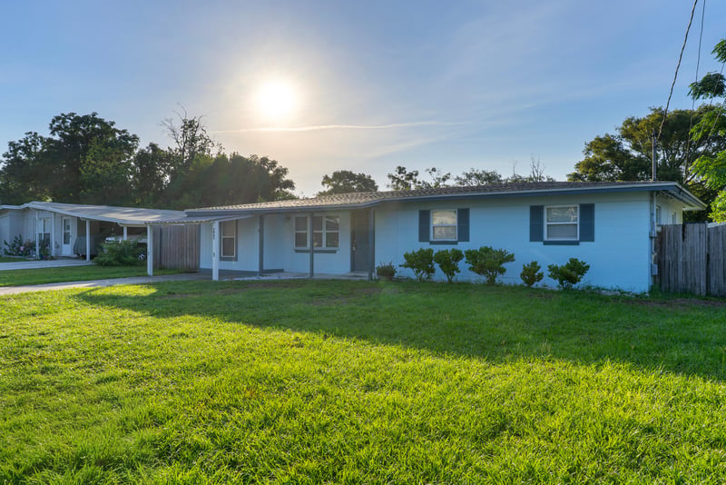 Front exterior with morning sun in sky at 442 Ameca Ave, Orange Park, FL 32073