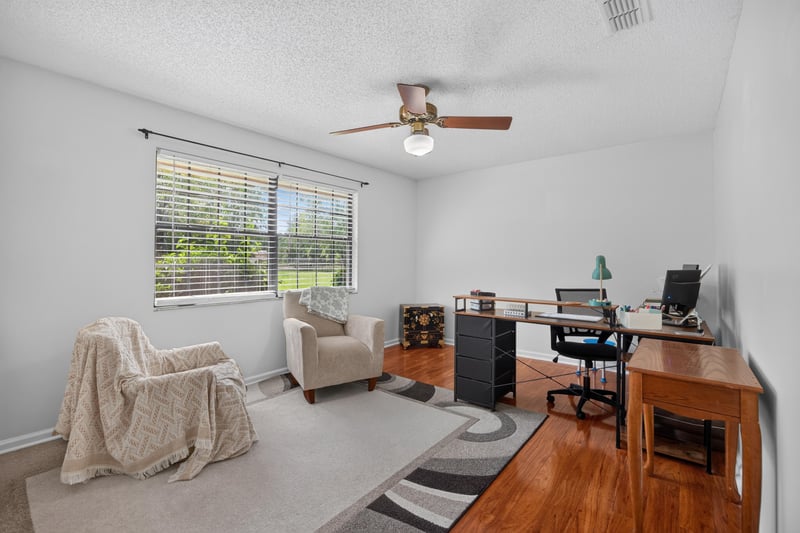 Front room with desk, chair and ceiling fan at 2435 Range Line Rd, Middleburg, FL