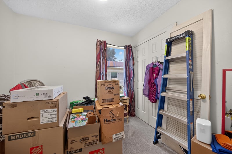 Storage room with shelving and ladder at 5375 Dodge Rd, Jacksonville, FL 32209