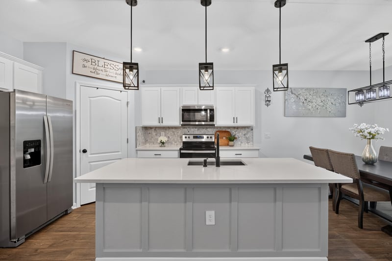 Kitchen with stainless appliances and pendant lighting at 65255 Frst Glen Ln, Yulee, FL 32097