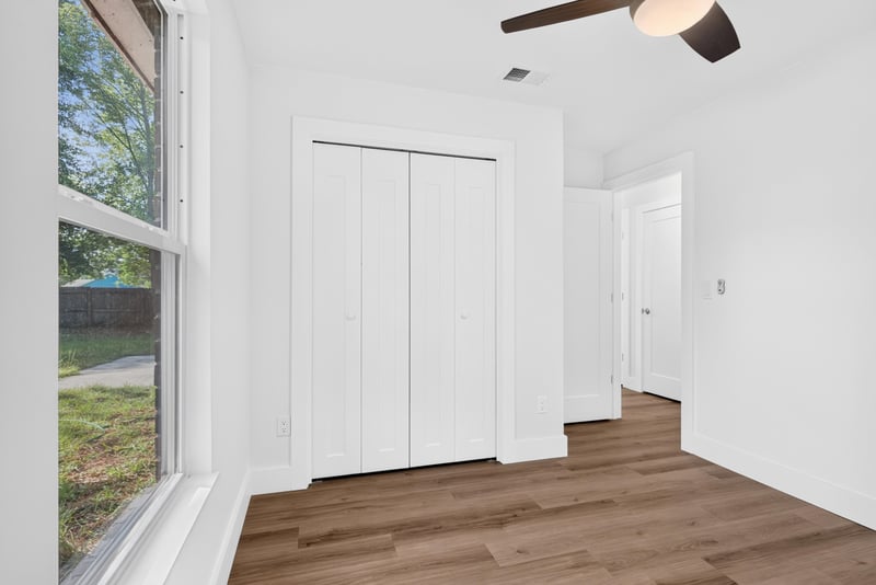 Empty bedroom with closet door and window at 8453 Boysenberry Ln W, Jacksonville, FL