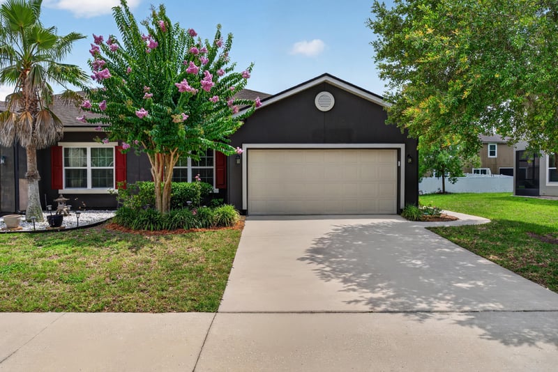 Front exterior view toward garage and driveway at 2378 Caney Oaks Dr, Jacksonville, FL