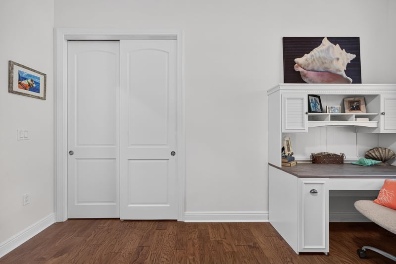 Hallway with closet doors and built-in desk nook at 140 Ave De La Mer, Palm Coast, FL 32137