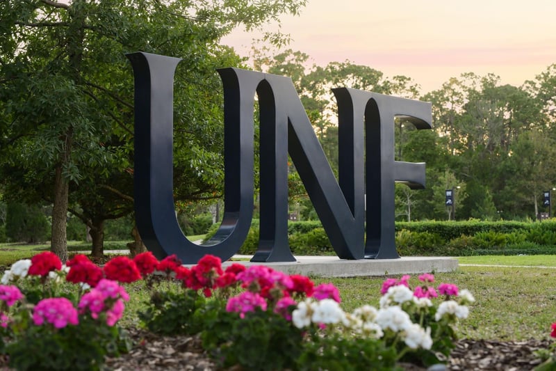 UNF campus sign with flower beds in Jacksonville