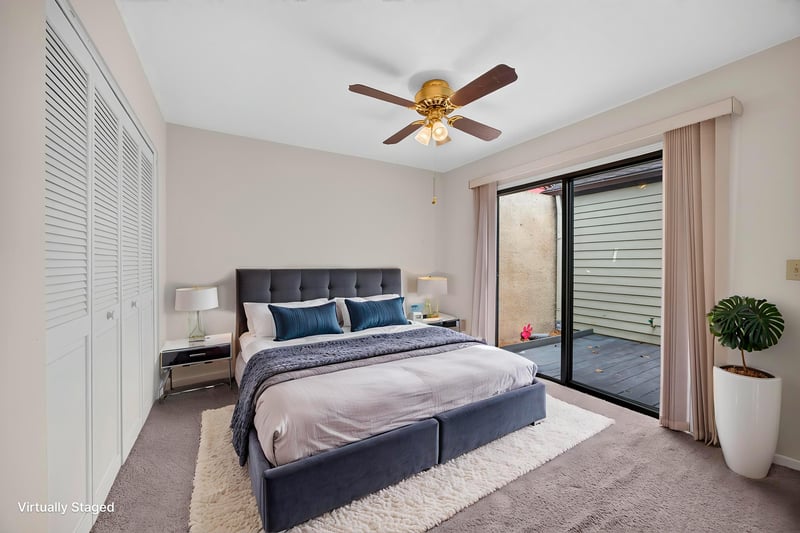 Staged primary bedroom with sliding doors and closet at 3407 Fairbanks Grant Rd N, Jacksonville, FL 32223