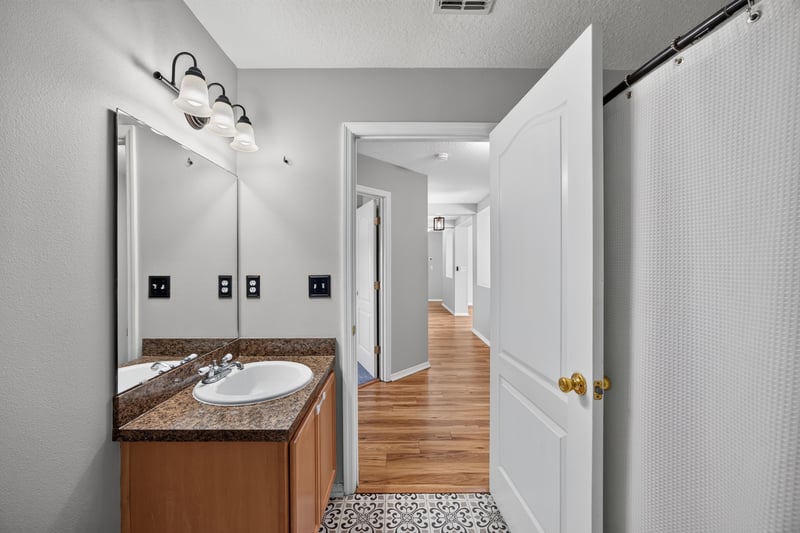 Bathroom hallway with vanity at 7545 Lirope St, Jacksonville, FL 32244