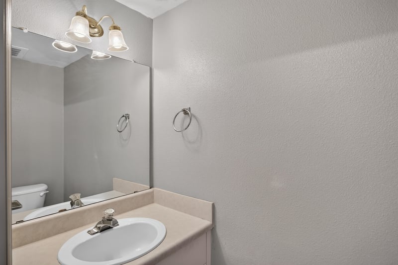 Bathroom sink and mirror at 342 E Ashley St, Jacksonville, FL 32202