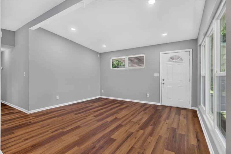 Living room view toward side entry door at 1928 Montmarte Dr, Jacksonville, FL 32210