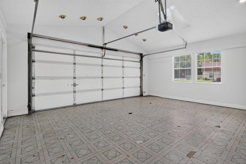 Garage with overhead door and windows at 400 Ashcroft Landing Dr, Jacksonville, FL 32225