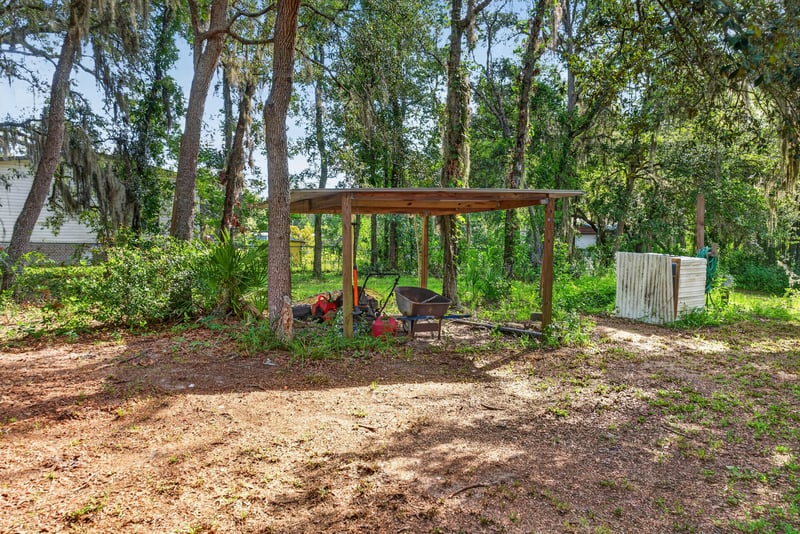 Backyard with pergola and storage shed at 3215 Robin Ln, Middleburg, FL
