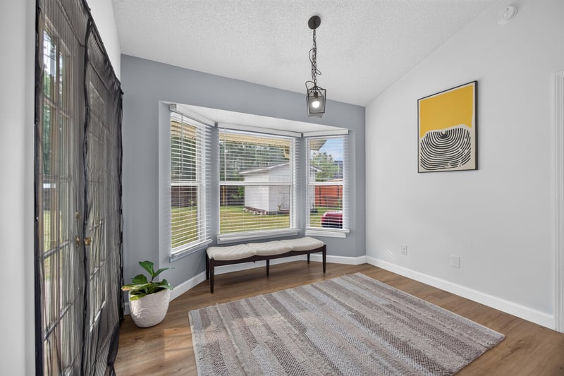 Breakfast nook with bench seating and window light at 8921 Needlepoint Pl, Jacksonville, FL 32244