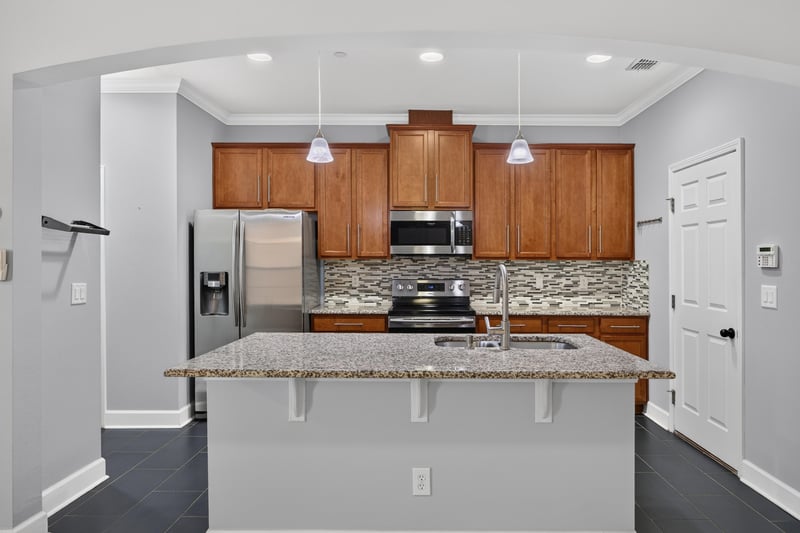 Kitchen with pendant lighting and tile backsplash at 6217 Eclipse Cir, Jacksonville, FL 32258