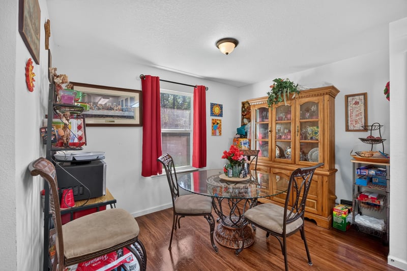 Dining area with round table and china cabinet at 518 Matecumbe Ct, Macclenny, FL