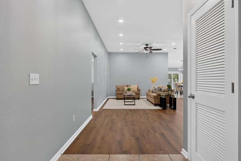 Entry hallway with wood-look floors at 706 Grampian Highlands Dr, St. Johns, FL 32259