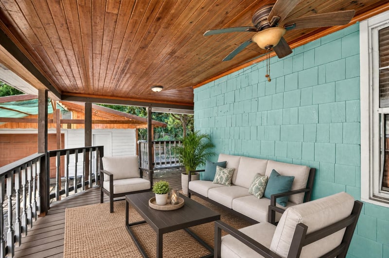 Covered back porch with seating area and wood ceiling at 2841 Ernest St, Jacksonville, FL 32205