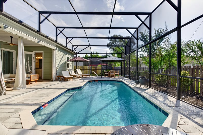 Pool and covered lanai with columns at 3328 Southern Oaks Dr, Green Cove Springs, FL 32043