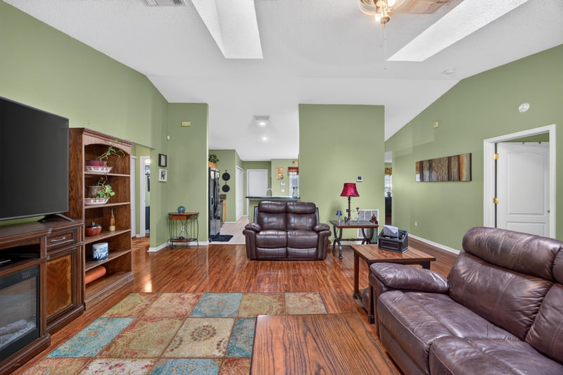 Family room with entertainment center and seating at 145 Dover Bluff Dr, Orange Park, FL