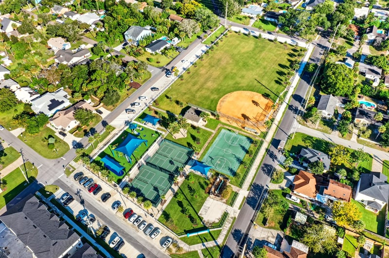 Aerial view of the park with pool, courts and parking in Jacksonville Beach, FL