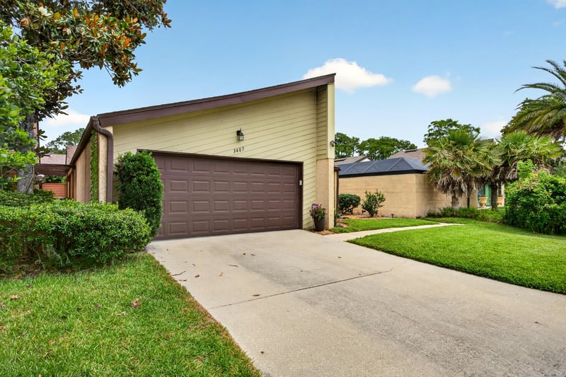 Front exterior view of driveway and garage at 3407 Fairbanks Grant Rd N, Jacksonville, FL 32223