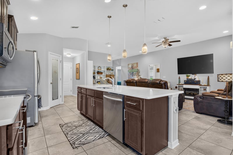Kitchen island with dishwasher and pendant lighting at 589 Seville Pkwy, St. Augustine, FL