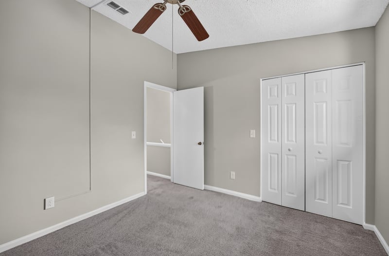 Empty bedroom with closet doors at 3801 Crown Point Rd, Jacksonville, FL 32257