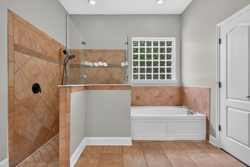 Bathroom with walk-in shower and soaking tub at 4109 Eagle Landing Pkwy, Orange Park, FL 32065