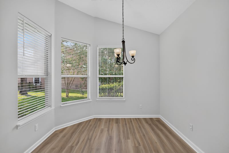 Dining area bay window with chandelier at 3101 E Banister Rd, St. Augustine, FL 32092