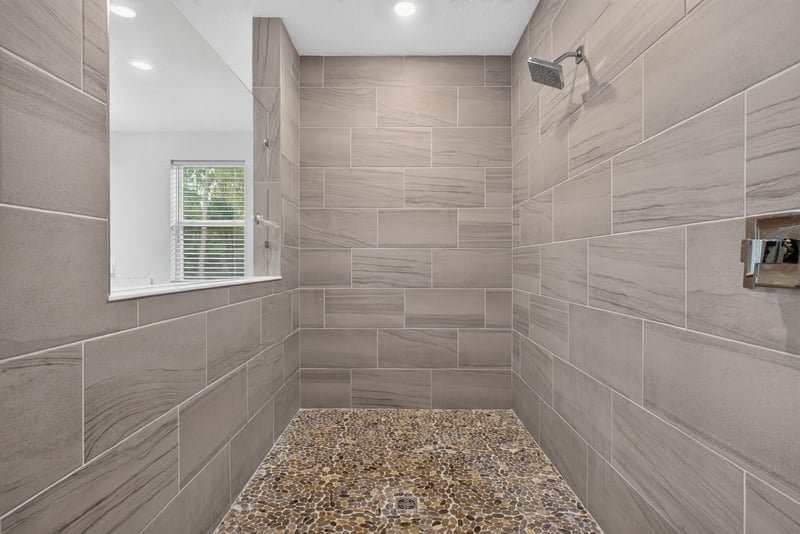 Primary bathroom walk-in shower at 22 Azura Point