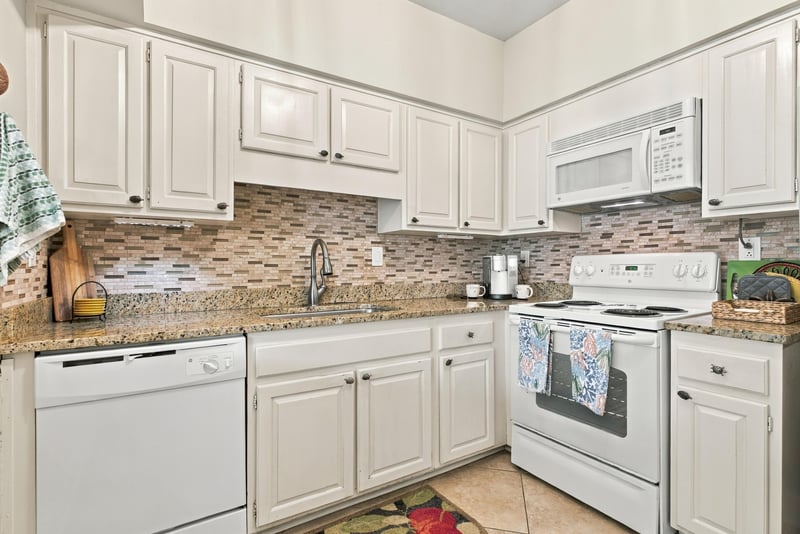 Kitchen counter with tile backsplash and microwave at 805 Spinnakers Reach Dr, Ponte Vedra Beach, FL 32082