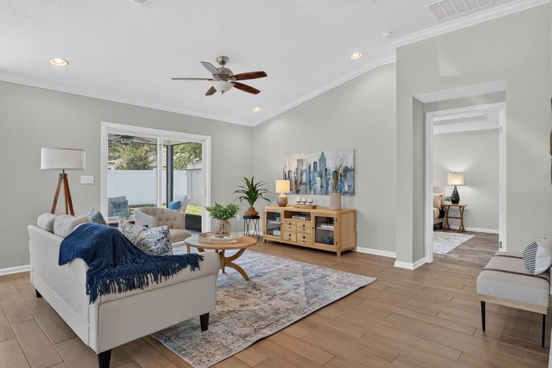 Living room with vaulted ceiling and ceiling fan at 10066 Andean Fox Dr, Jacksonville, FL 32222