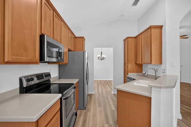 Kitchen with granite counters and stainless range at 3101 E Banister Rd, St. Augustine, FL 32092