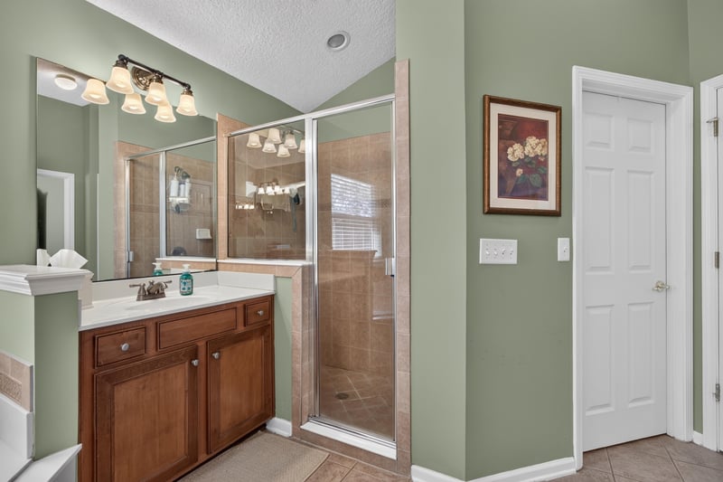 Primary bathroom with soaking tub and glass shower at 3660 Middlebrook Dr, Orange Park, FL 32065