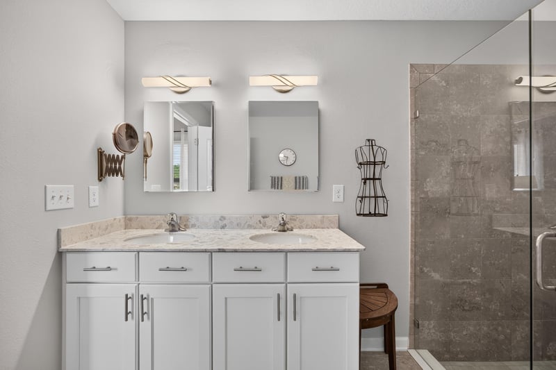 Primary bathroom vanity with mirrors at 85 Amia Dr, St. Augustine, FL 32086