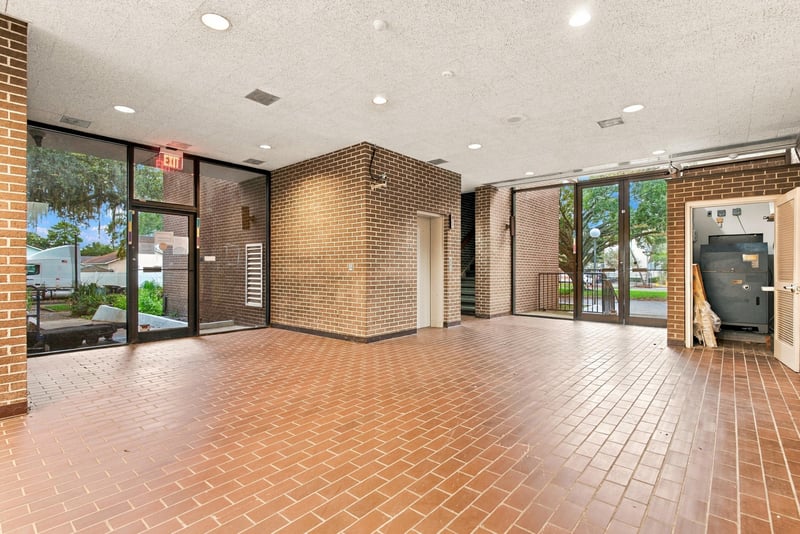 Entry lobby with tile flooring and glass doors at 101 Scholars Wy