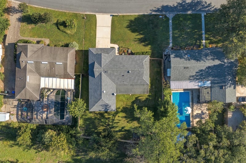 Drone aerial view of the neighborhood and nearby pools, photographed by Megapixeler on Crosby Ln, Orange Park